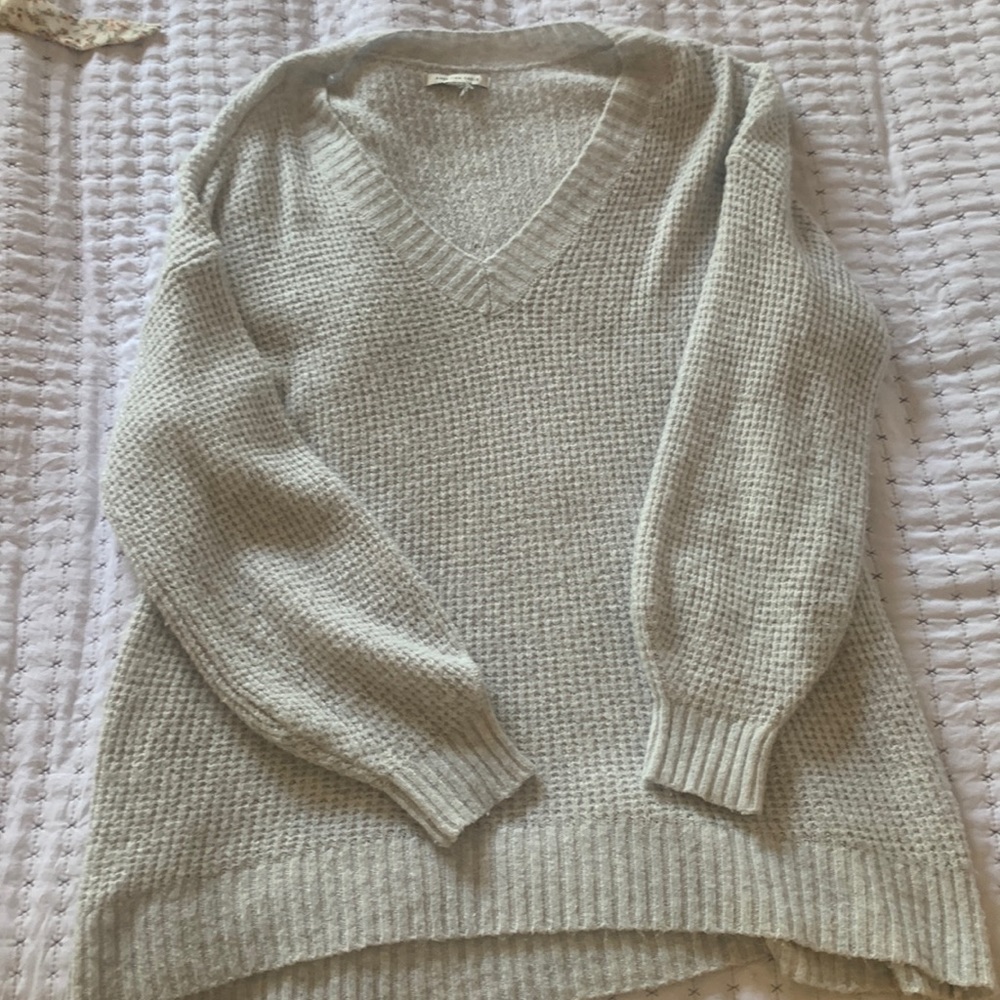 This is a grey crochet American eagle sweater